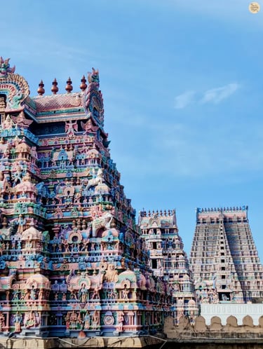View of three temple gopurams in a row with the towering Rajagopuram of Sri Ranganathaswamy Temple, Srirangam, Tamil Nadu.