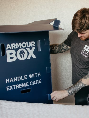 box being carried by deanos removals