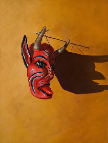 Painting of a red devil Mexican mask on a yellow background