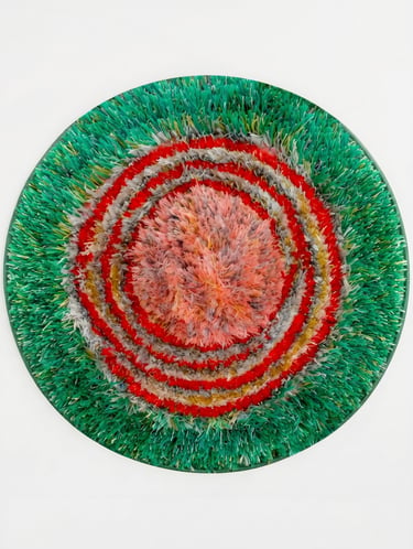 Round floral design heavy shaggy hand-tufted rug in green red and coral pink from Shreempex India