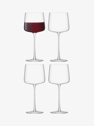 a group of wine glasses with wine glasses