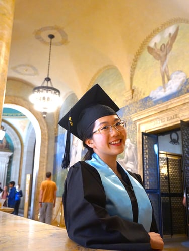 a woman in a graduation gown and cap - toe shoes