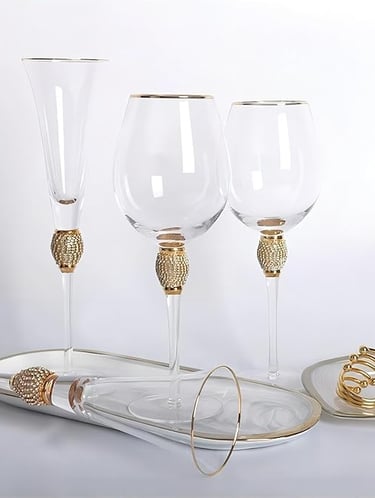 Set of four rhinestone gold-rim champagne flutes, luxury sparkling glassware.