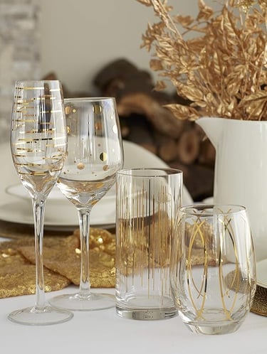 Elegant crystal glass set with gold detailing, luxury drinkware for stylish dining.