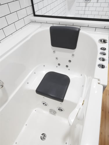 Walk-in whirlpool bathtub with built-in seat and jets installed by Toledo New Bath.