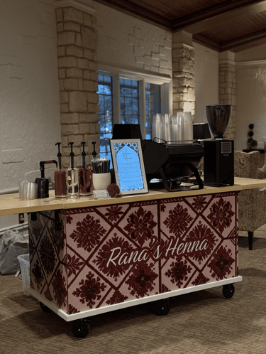 Custom wrapped mobile coffee cart featuring traditional tatreez embroidery pattern for Dallas events