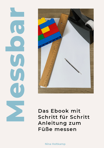 Messbar eBook guide for measuring feet featuring paper, ruler, and building blocks on a desk.