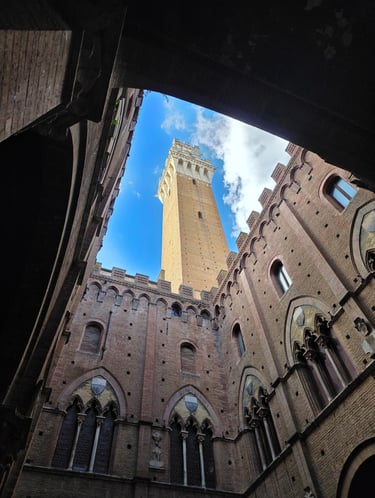 a clock tower in a building with a sky view