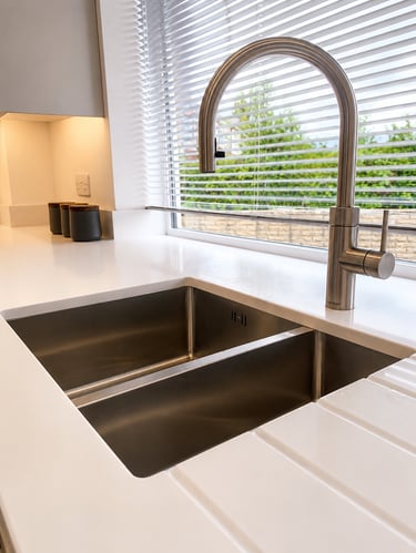 Stainless steel undermount kitchen sink with a modern swan-neck boiling water tap, fitted in Iffley