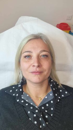 a woman in a hospital bed with a hospital bed