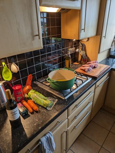 a kitchen counter top with a bowl of vegetables