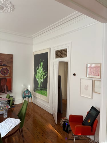 A gallery style home installation with thoughtful placement of our clien'ts artworks