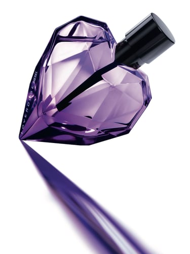 a purple perfume bottle with a diamond shaped diamond