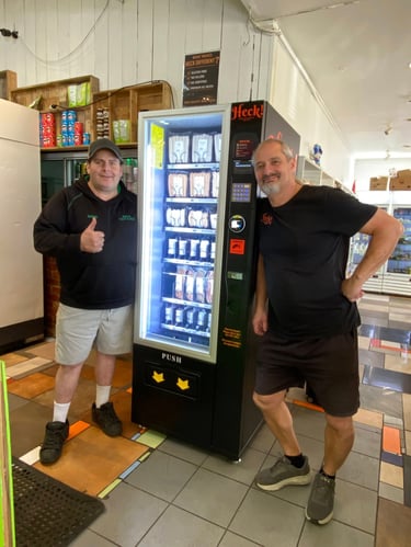 Commercial snack and drink vending machine installed at an Australian retail location.
