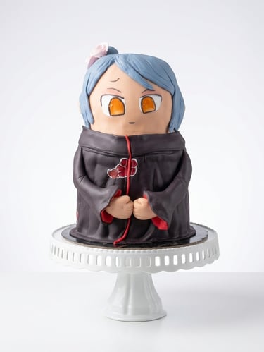 Torta temática estilo anime elaborada por Cocina con Ely, diseñada en formato 3D y decorada con figu