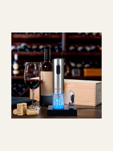 Secura Electric Wine Opener near a bottle of red wine and a glass of red wine