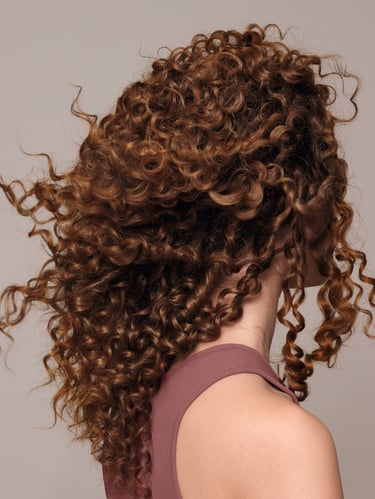 a woman with curly hair