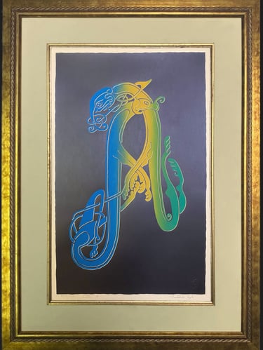 A black handprinted black Irish Celtic letter A in a gold frame 