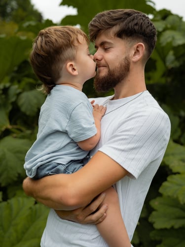 Father with son nose to nose photograph
