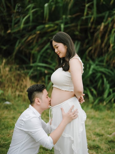 romantic beach maternity moment in Bali with natural light