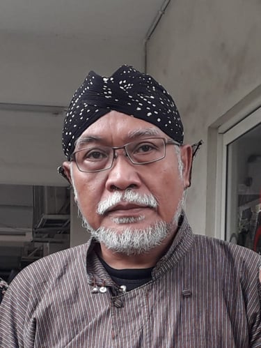 a man with a black hat and glasses