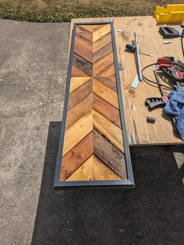 a chevron sign with black trim around it