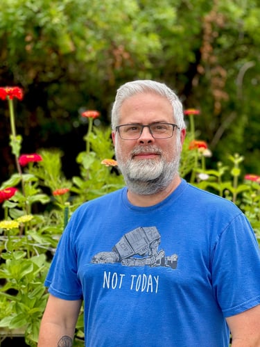 Jason with zinnia flower bed
