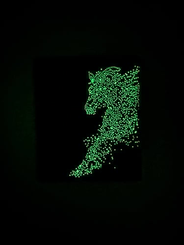 Glow-in-the-dark green dotted horse silhouette art on a black background for wall decor.