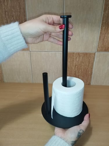 Matte black stainless steel paper towel holder with anti-slip base and top handle, kitchen