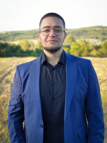 a man in a blue suit and glasses