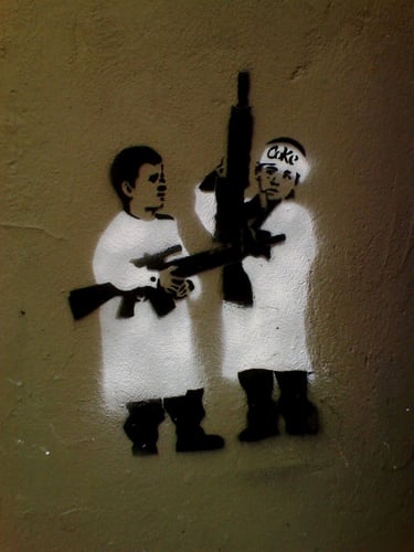 Boys being taught to wage war