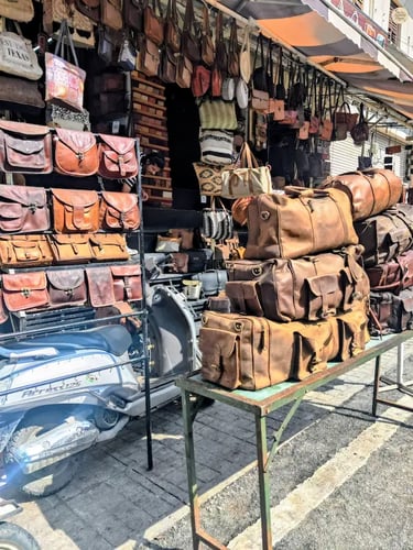 Handcrafted leather items displayed at bapu bazar Udaipur Rajasthan.