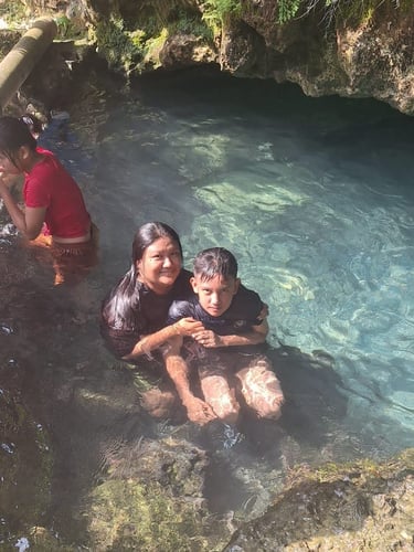 Relaxing in the water in Busay Cave