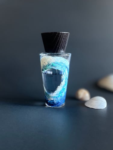 His perfume bottle with rising ocean wave painted on it for a beautiful luxurious gift creating last