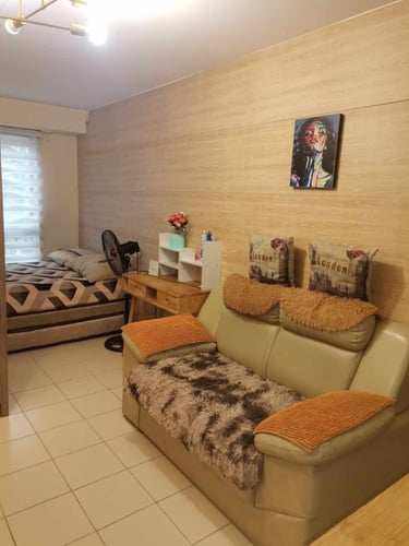 a couch with pillows and pillows in a room