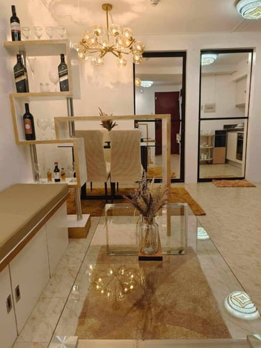 a living room with a glass table and a glass table