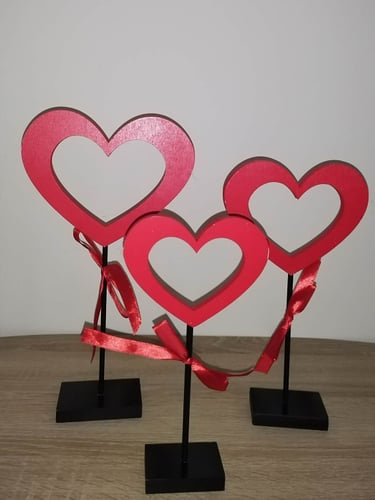 Set of three red Valentine’s Day heart wooden signs on stands, decorative tabletop love accents