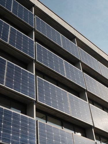 Low-angle detailed shot of a modern sustainable building facade with integrated solar shading panels under crisp daylight
