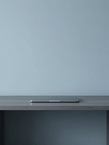 Minimalist developer workspace with cool, diffused daylight, slate blue and graphite tones, architectural lines