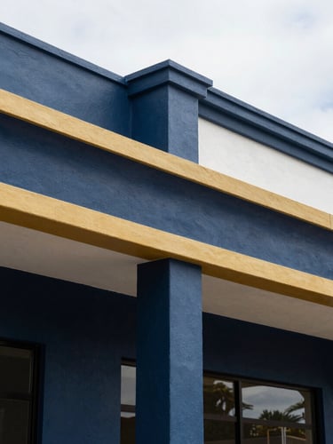 Sharp architectural close-up of newly finished exterior waterproofing and clean paint lines on a Durbanville commercial property, bright natural daylight