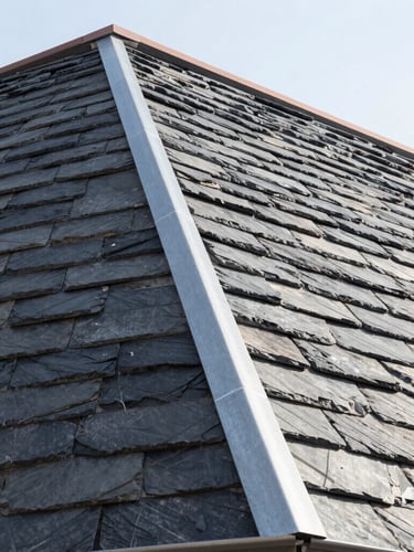 Low-angle architectural shot of a modern slate roof with clean zinc seams against a bright daylight sky, sharp details, high contrast