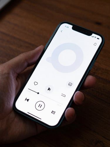 A high-fidelity Android device mockup displaying a minimalist media controller widget with crisp electric cyan borders, held in a hand over a dark wooden desk, moody ambient side-lighting.