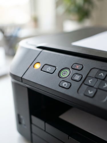 Crisp macro shot of a printer control panel with a blinking amber light, bright natural workspace light, shallow depth of field.