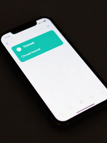Close-up overhead shot of a smartphone screen displaying a transaction cleared notification, flat studio lighting, teal accent glow from screen illuminating the dark surface beneath, tight crop showing only the device top third and notification banner