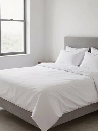 Bright modern bedroom in Saltillo with a neatly made queen size bed, soft daylight streaming through a window, clean white sheets, neutral gray headboard, editorial 50mm lens style.