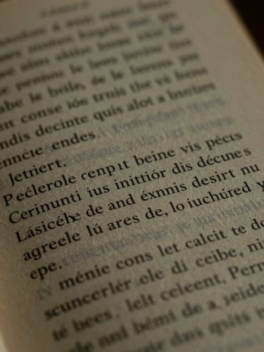 Macro shot of a printed book page in French, elegant serif typography, soft shadows, warm tactile paper texture.