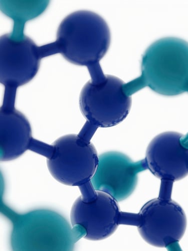 Macro shot of abstract geometric 3D molecular structures in deep blue and medical teal, bright high-key lighting, clean white background, conveying scientific precision.