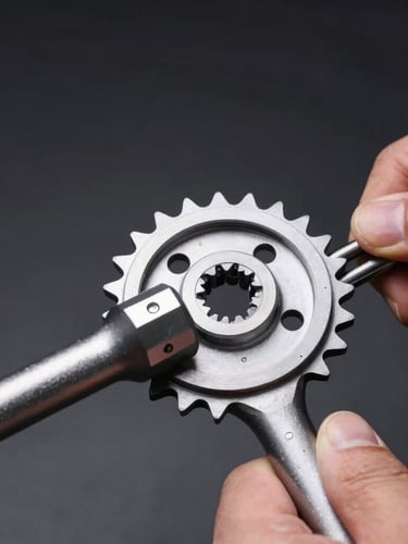 Macro close-up of a mechanic's hands using a professional torque wrench to install a high-performance rear sprocket, cool garage workshop lighting, metallic details.