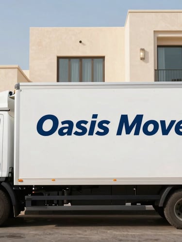 A clean, organized Oasis Movers truck with professional branding parked outside a modern villa in Fujairah under bright morning desert sun.