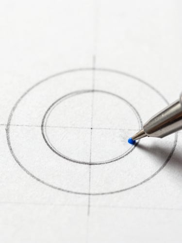 Extreme macro top-down shot of a technical drawing pen sketching pristine geometric circles on heavy grid paper, sharp shadows, minimalist studio lighting